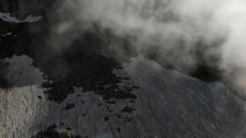 High grey mountain landscape with thick white clouds Stock Footage 112924127