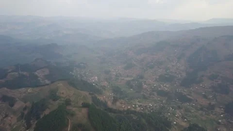 High Hazy View of Rolling Hills, Broad Valley and Scattered Village, Kigezi Stock Footage 348115012