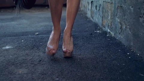 High heeled walking on rough terrain Stock-Footage 132638118