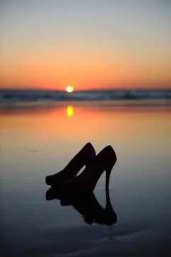 High heels on the evening beach Stock Photos
