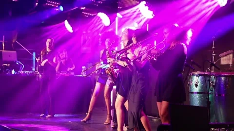 High on Heels group playing on stage with bright purple light, slow motion Stock-Footage 219316387