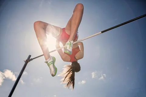 High jumper clearing bar Stock Photos