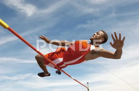 High Jumper In Midair Over Bar Stock Photos