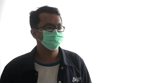 High key video of a young man wearing a mask with glasses Video stock 162940519