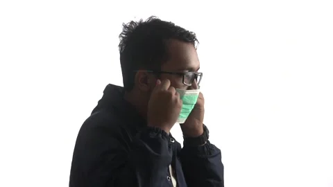 High key video of young man with glasses wearing a medical mask Video stock 162940559
