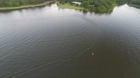 High up at the lake watching a single jet ski Video stock 50446987