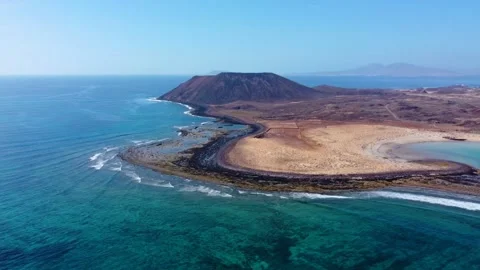 High level aerial panning clip of the stunning Lobos island Fuerteventura Stock Footage 196986010
