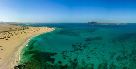 High level aerial panoramic view of the beautiful Flag Beach, Corralejo Stock Photos