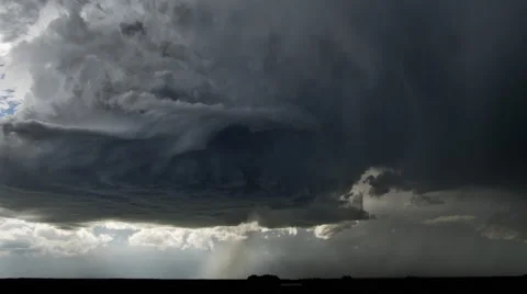 High-level base of a thunderstorm showing updraft and rotation, as hail pours Stock Footage 59143157