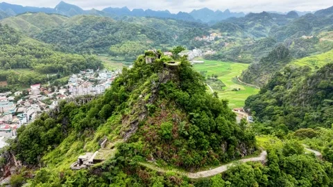High level drone forward flight over French fort overlooking Dong Van 4K Stock Footage 341543312