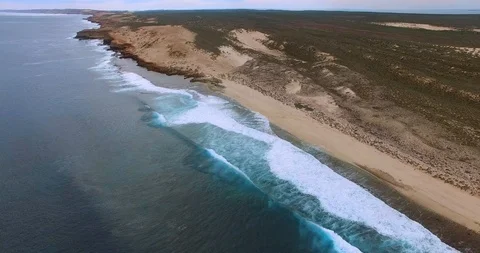 High level flight along a line of swells  breaking at Surf Point, Shark Bay Video stock 92843859