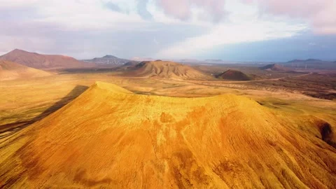 High level orbital clip of the volcanic mountain Montana Roja Fuerteventura Stock Footage 196987121