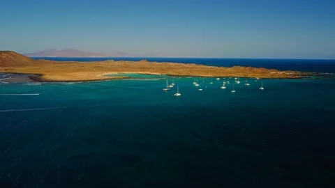 High level pan clip of Lobos island Corralejo Fuerteventura Stock Footage 176891076