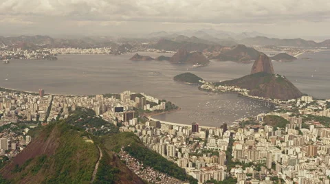 High level view of Inner City with Sugar Loaf and Maracana Football Stadium Stock Footage 64864893