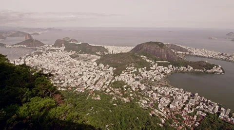 High level view of Lago de Rodrigo Freitas Lagoon and distant Sugar Loaf Stock Footage 64865146