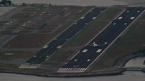 High level view on starting Plane in front of Ilha Fiscal Video stock 64865080