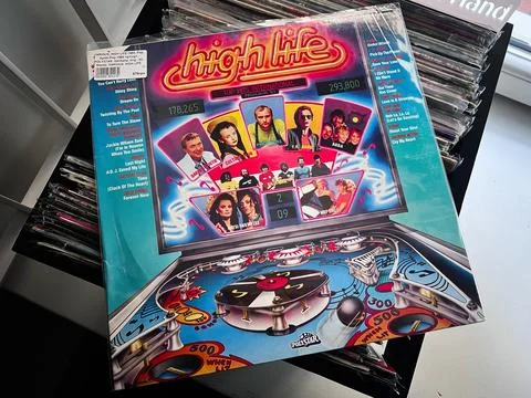 High Life various artists compilation 1983 vinyl cover with neon pinball ar.. Stock Photos