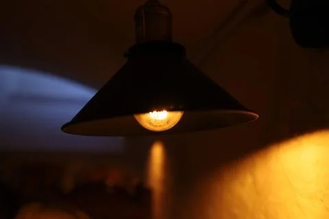 High light above the table in a dark cafe Stock Photos