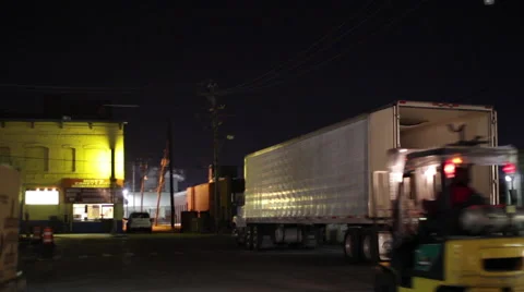 High Low driving through market district at night Stock Footage 45282223