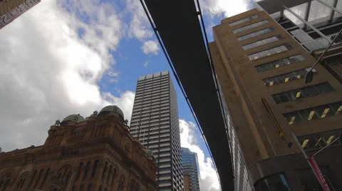 A high to low tilt at intersection on george street sydney cbd Video stock 36699421