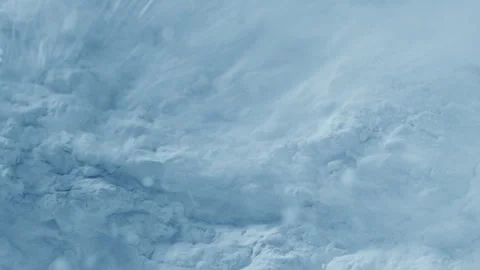 High-magnification slow-motion shot of torn blue powder Stock Footage 340003392