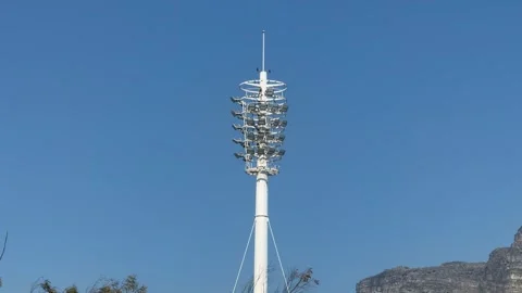 High Mast Stadium Floodlight Tower Against Clear Blue Sky Stock Footage 346466995
