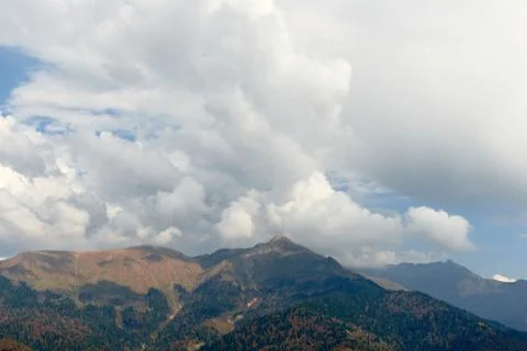 High mountain and sky with clouds in autumn. Beautiful landscape.. Stock Photos