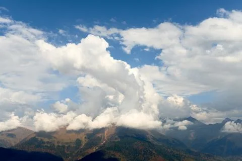 High mountain and sky with clouds in autumn. Beautiful landscape. Stock Photos