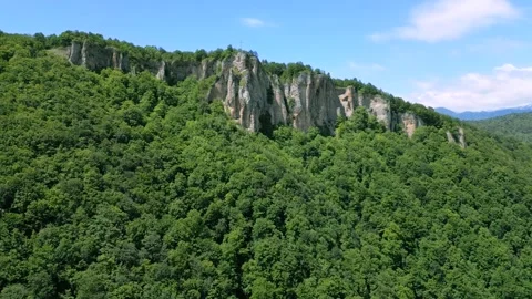 High mountain cliffs surrounded by forest Stock Footage 278226917