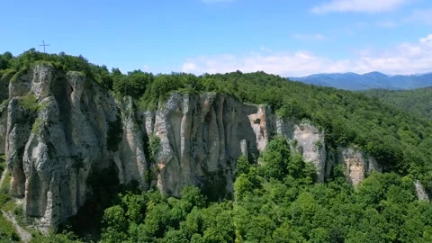 High mountain cliffs surrounded by forest Stock Footage 278226924