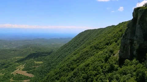 High mountain cliffs surrounded by forest Stock Footage 278228020