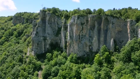 High mountain cliffs surrounded by forest Stock Footage 278228382