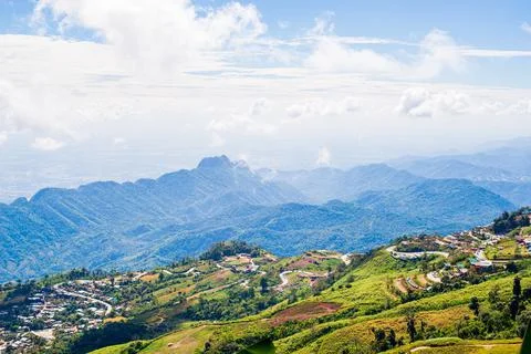 On a high mountain with floating clouds. Sunny, beautifully bright weather. Stock Photos