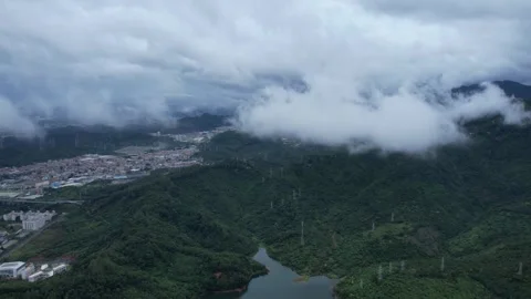 High Mountain Lake with Swirling Clouds Views Aerial Video stock 320788909