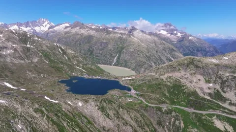 High mountain meadows. Majestic mountains and tranquil waters Switzerland nature Stock Footage 312702891