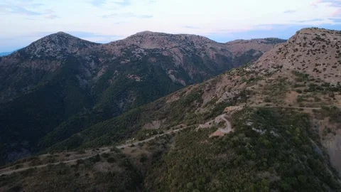 High mountain pass with steep slopes, cliffs and deep green valleys in Greece Stock Footage 321892425