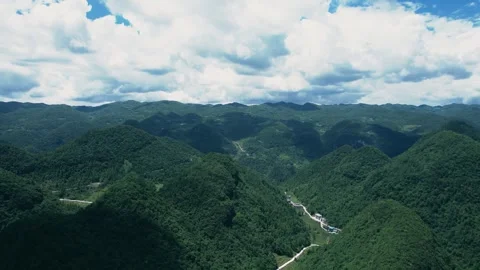 High Mountain Peaks with Dramatic Clouds Views Aerial Stock Footage 320810539