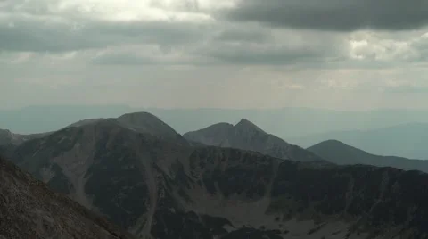 High Mountain Peaks with Sun Rays 4K Stock Footage 67477976