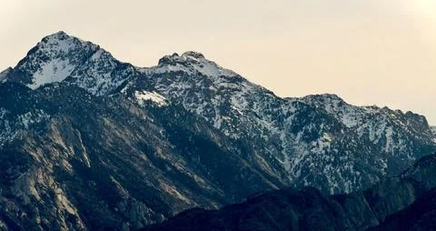 The high mountain range under the tranquil early morning sky. Stock Photos