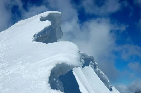 High mountain ridge over cloudy sky Stock Photos