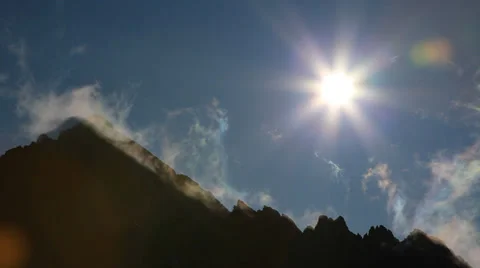 A high mountain ridge over fast moving clouds (no time lapse) - HD1080p Stock Footage 34447983