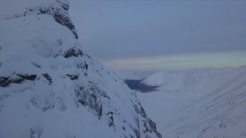 High mountain under white thick snow layer above deep ravine Stock Footage 112532660