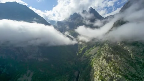 High mountains above the clouds, low clouds in the North Caucasus mountains Stock Footage 291960144