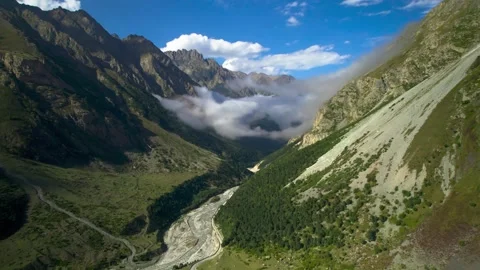 High mountains above the clouds, low clouds in the North Caucasus mountains Stock Footage 291960175