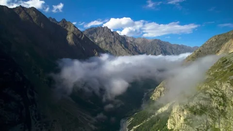 High mountains above the clouds, low clouds in the North Caucasus mountains Stock Footage 291960414