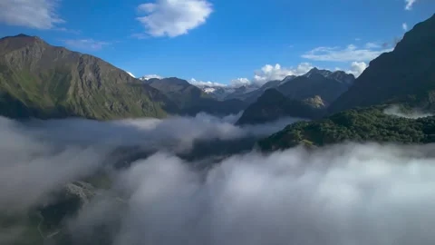High mountains above the clouds, low clouds in the North Caucasus mountains Stock Footage 291960777
