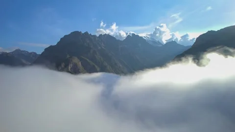 High mountains above the clouds, low clouds in the North Caucasus mountains Stock Footage 291960954