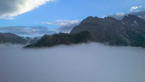 High mountains above the clouds, low clouds in the North Caucasus mountains Stock Footage 291961367