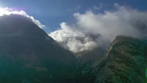 High mountains above the clouds, low clouds in the North Caucasus mountains Stock Footage 291969097