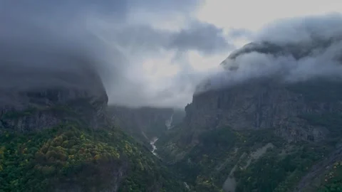 High mountains above the clouds, low clouds in the North Caucasus mountains Stock Footage 291969453